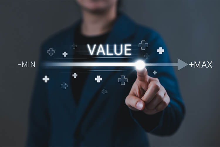 Man pointing at graphic raising the value to the max